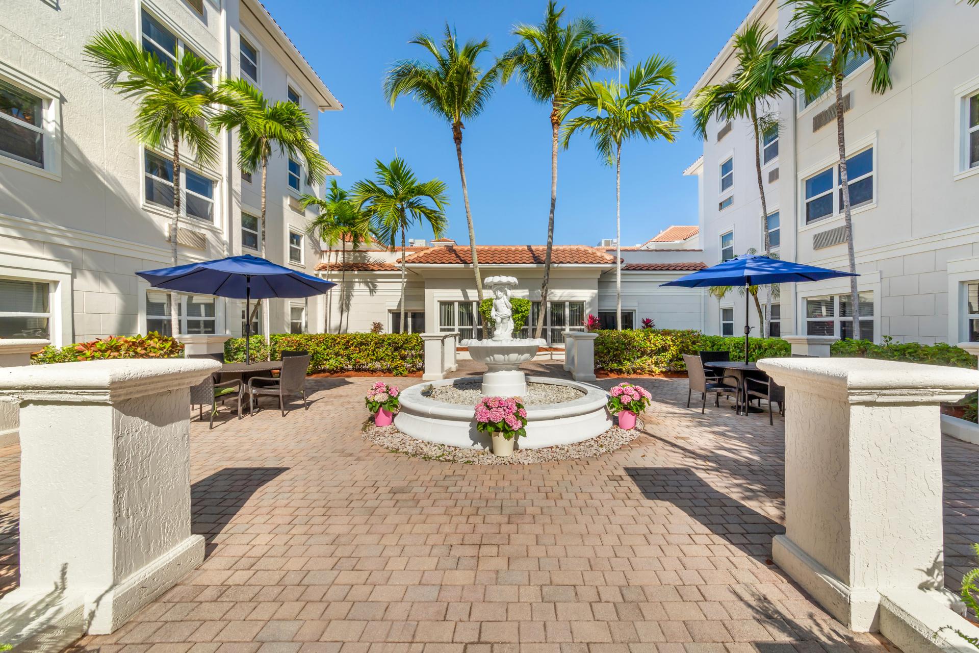exterior garden area with gazebo seating and fountain