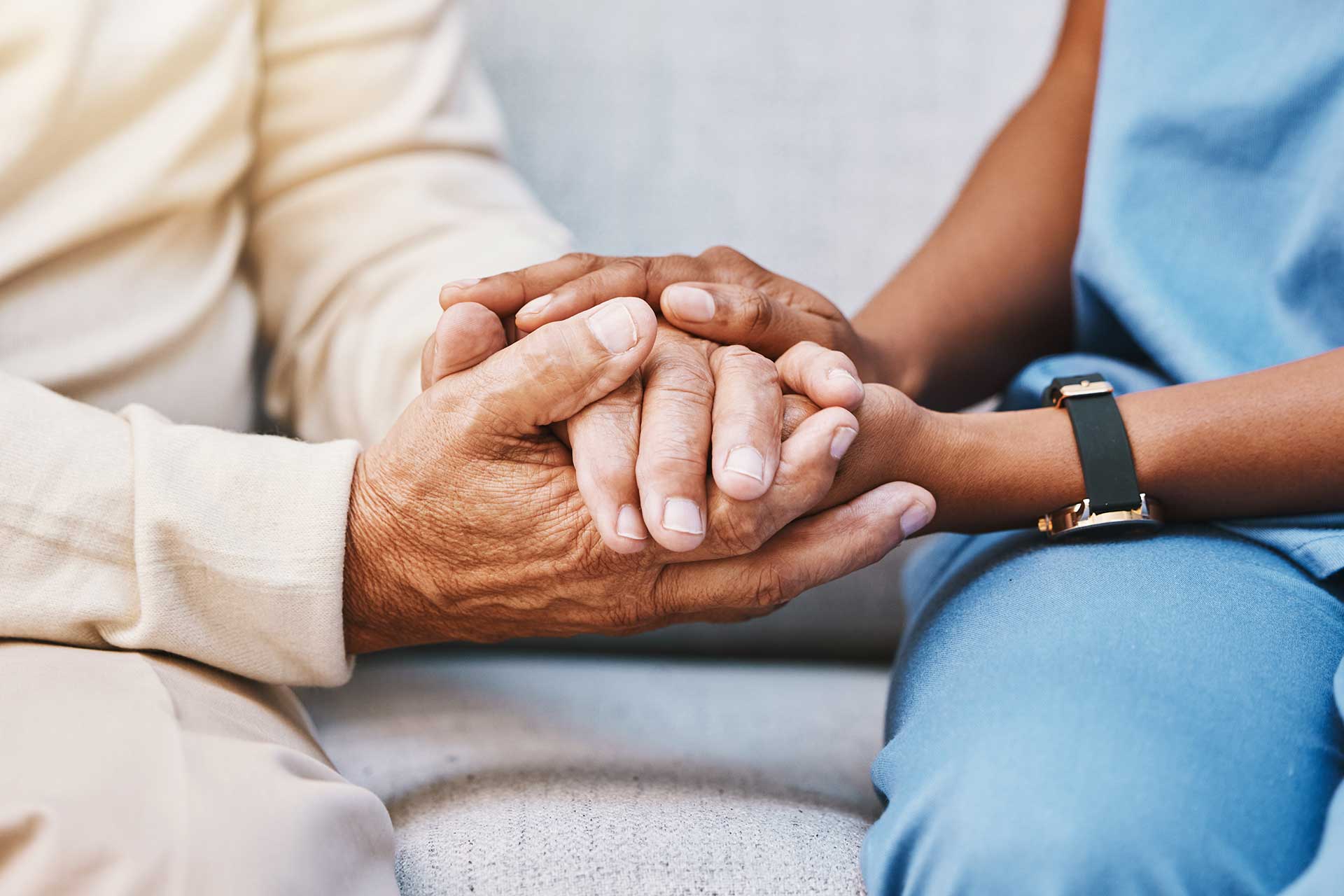 PLC_Verification_560060526_1920x1280_web a senior care resident and a community caregiver share a moment while holding hands